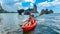 Family kayaking, mother and daughter paddling in kayak on tropical sea canoe tour near islands, having fun, Thailand, Krabi