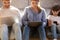 Family with kid sitting on floor absorbed in digital devices