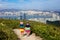 Family with kids hiking in Hong Kong mountains. Beautiful landscape with hills, sea and city skyscrapers in Hong Kong, China.