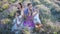 Family in lavender flowers field at sunset in white dress and hat