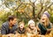 Family laying in park with home outline