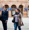 Family leaving polling place French city flags