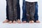 Family legs in jeans portrait