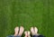 Family legs standing together on green grass