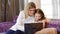 Family leisure mom daughter watch together laptop