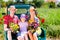 Family on light truck with flowers