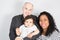 Family with little son on white background with bald man