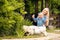 Family look. Blonde Mother and daughter holding and playing on summer park. Happy family lifestyle concept. Beautiful portrait of