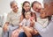 Family, love and children with grandparents and kids on a sofa in the living room during a visit at home. Happy, smile