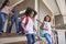 Family With Luggage Leaving House For Vacation