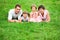 Family lying on grass