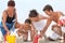 Family making sandcastle