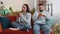 Family marriage couple man woman using smartphones after argument quarrel at home, ignore each other