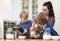 Family Mixing Cupcake Batter In Kitchen