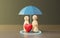 Family model with Red heart model and umbrella, Family insurance concept, children healthcare