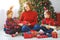 Family mother and children open presents on Christmas morning