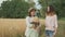 Family mother and children two daughters walking together along country road