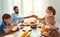 Family mother father and children have Breakfast in kitchen in morning