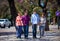 Family mother, sons and grandmother in the park