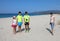 Family with mother and three children on the beach