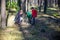 Family with mother and two children boy sibling brothers sits in