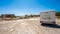 Family with motorhome exploring abandoned factory buildings in Crete, Greece