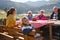 A family on a mountain vacation indulges in the pleasures of a healthy life, savoring traditional pie while surrounded