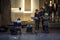 Family of musicians, pianists and violonists, performing in a street of Belgrade, observing and admiring the kid playing piano.