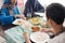 Family muslim eating in dinner table together