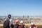 Family observing an Aerial panoramic view of Lyon with the skyline and the the major districts of the city visible.