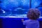 Family observing fish at the aquarium