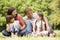 Family outdoors smiling