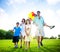 Family In Outdoors Walking Towards A Camera