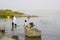 A family paddling in the water at the western shore of the Sea of Galilee