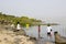 A family paddling in the water at the western shore of the Sea of Galilee