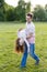 Family, parenthood, fatherhood and people concept - happy man and little girl in having fun in summer park. Cute curly girl