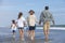 Family Parents Girl Children Walking on Beach