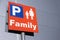 Family parents with kids children car park sign at shopping mall retail park