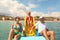 Family on pedal boat with slide in sea
