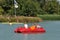 Family on pedalo on the pond of the leisure center of Jonzac