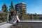 Family people walking wooden treetop observation deck walkway in winter