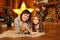 Family photo of mother and daughter laying on the floor at fireplace with cute rabbit. Christmas decoration