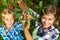 Family picking red cherry from tree