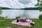 family picnic with view of serene lake and greenery