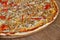 Family pizza wooden background