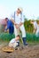 Family planting potatoes in vegetable garden