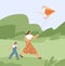 Family playing with air kite and fly it to sky. Mother and kid walking with toy outdoors. Mom and child at summer