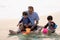 Family playing on the beach. Parents and children relaxing on the beach in the summer.happy healthy family Grandfather and Nephew