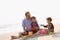 Family playing on the beach. Parents and children relaxing on the beach in the summer.happy healthy family Grandfather and Nephew