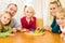 Family playing a board game